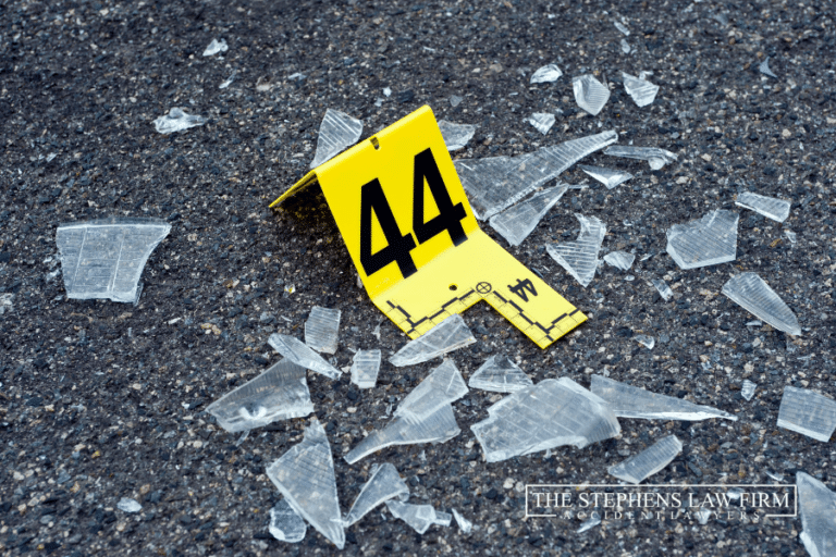 a yellow "44" placard placed next to broken glass to preserve accident evidence