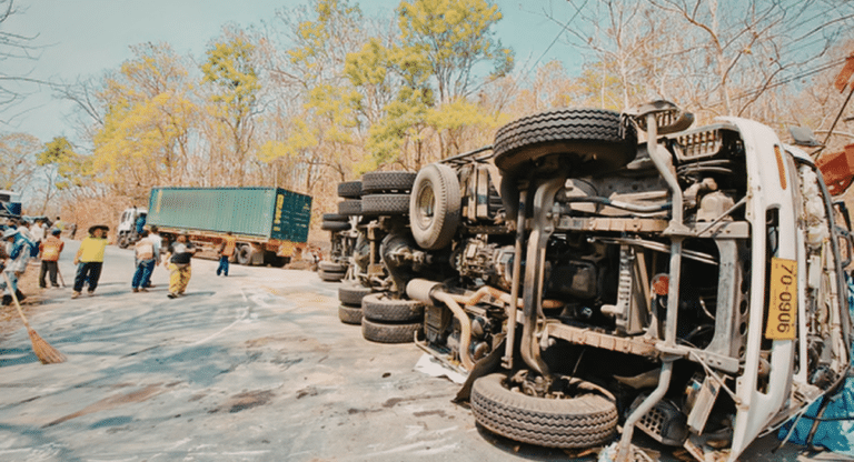 a truck toppled on the road after an accident