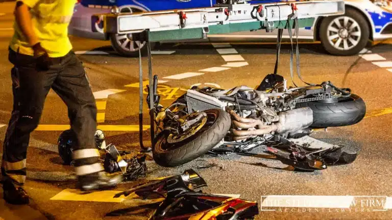 firefighter cleaning motorcycle crash