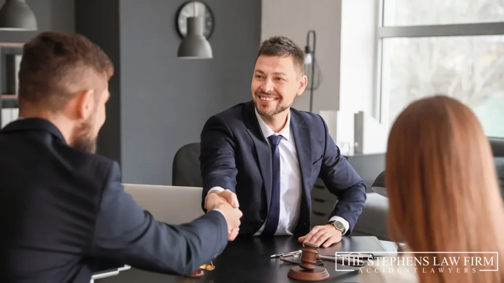 An image of a lawyer and client shaking hands.