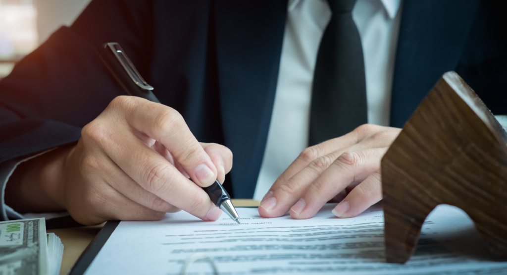 Lawyer signing a document